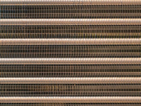 Aluminum radiator for engine cooling and car air conditioning. Refrigeration system cooling condenser. Refrigerator evaporator. Car repair workshop. Refrigerator repair. Air conditioning system.