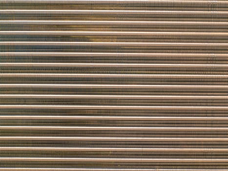 Aluminum radiator for engine cooling and car air conditioning. Refrigeration system cooling condenser. Refrigerator evaporator. Car repair workshop. Refrigerator repair. Air conditioning system.