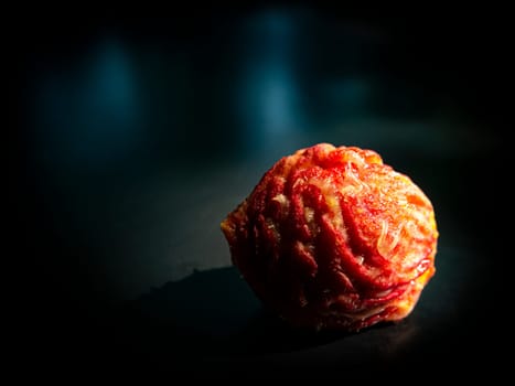 Peach fruit stone on a black background. Food photo. Harvesting. Peach juice. Agriculture. Advertising photo of a shop window of a fruit shop. Place for your text. Background image. Template.