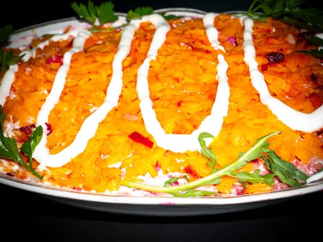 Vegetable salad with carrots decorated with parsley. Food photo. Menu of dishes. Recipe. Cooking food. Home kitchen. Vegetarianism. Healthy lifestyle. Place for your text. Template.