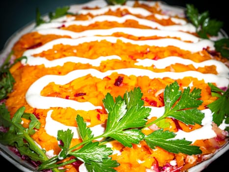 Vegetable salad with carrots decorated with parsley. Food photo. Menu of dishes. Recipe. Cooking food. Home kitchen. Vegetarianism. Healthy lifestyle. Place for your text. Template.