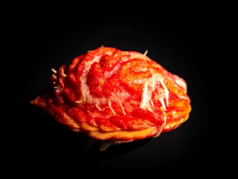 Peach fruit stone on a black background. Food photo. Harvesting. Peach juice. Agriculture. Advertising photo of a shop window of a fruit shop. Place for your text. Background image. Template.
