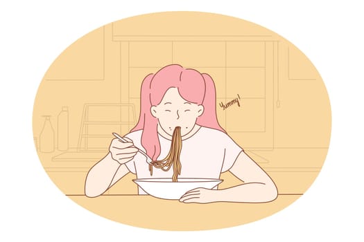 Eating yummy homemade food. Positive hungry girl sitting eating spaghetti pasta noodles with sauce for dinner at home. Healthy lunch meal supper meal cooked and served in plate