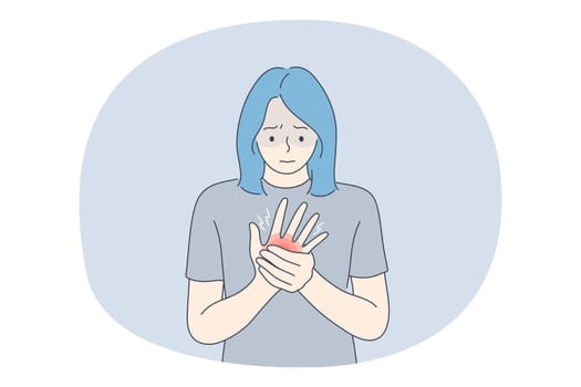 Suffering from pain in muscles, joints, injuries concept. Young unhappy woman cartoon character standing and holding painful palm feeling strong pain. Trauma, chronic illness, inflammation