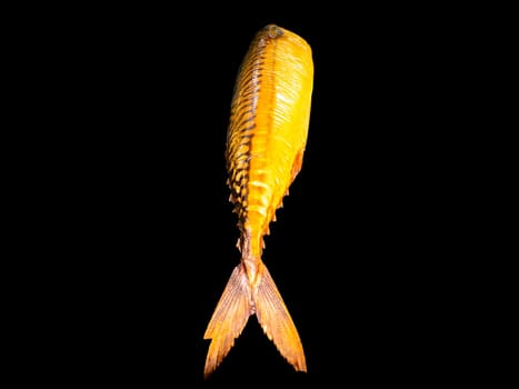 Smoked mackerel fish on a black background. Salted mackerel fish. Canned food. Food photo. Recipe. Menu of dishes. Vegetarian food. Home kitchen. Fishing. Background image. Place for your text.