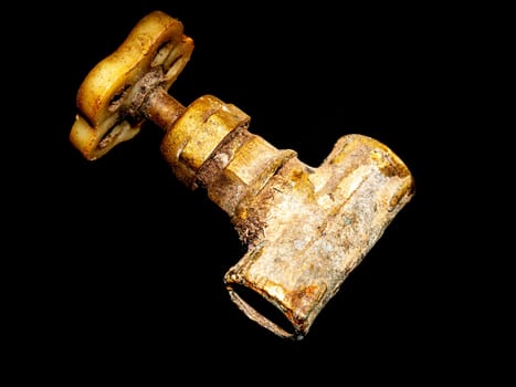 Faucet with a tap on a black background. Valve for opening and closing water. Plumbing equipment. Plumbing repair. Plumbing repairman. Pipeline. Background image. Place for your text.