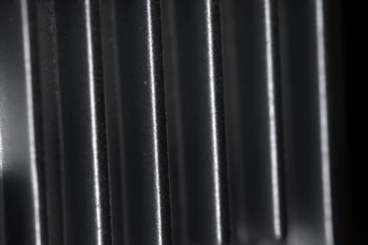 Abstract metal texture detail from the cooling fins of a drone gimbal heat sink. Aluminum or aluminium in material. Full frame abstract background.