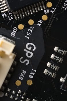 GPS related components on drone autopilot circuit board. Very detailed macro image of electronic circuitry. Modern technology in small aircraft.