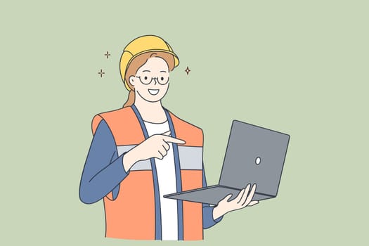 Architects using wireless technology concept. Young smiling beautiful woman cartoon character wearing protective helmet and uniform holding laptop and pointing with hand and finger