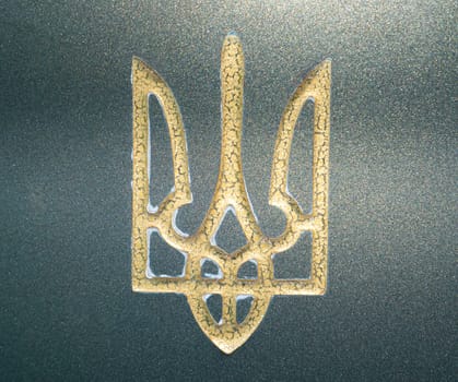 Golden coat of arms of Ukraine Trident on green marble. Ukrainian standard. Background image. Place for your text. Politics. Geography.