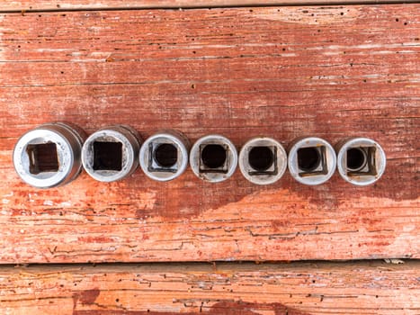 Tool interchangeable iron wrench heads in different sizes. Spanners. Worker tool. Work with your hands. Background image. Place for your text.
