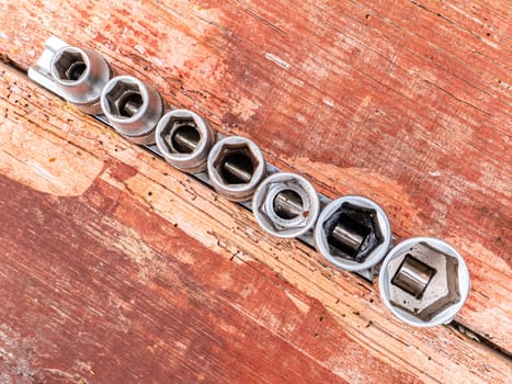 Tool interchangeable iron wrench heads in different sizes. Spanners. Worker tool. Work with your hands. Background image. Place for your text.