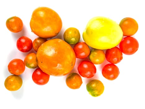 Harvest tomato vegetables on a white background. Ripe tomatoes. Agriculture. Shop window. Vegetable salad. Tomato juice. Background image. Place for your text.