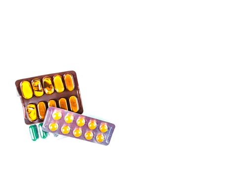 Medical medicine in pills on a white background. Pharmacy drugs in tablets. Pharmacology. Medical medicine in capsules. Pharmacy capsules for human treatment. Place for your text. Drugs in pills.