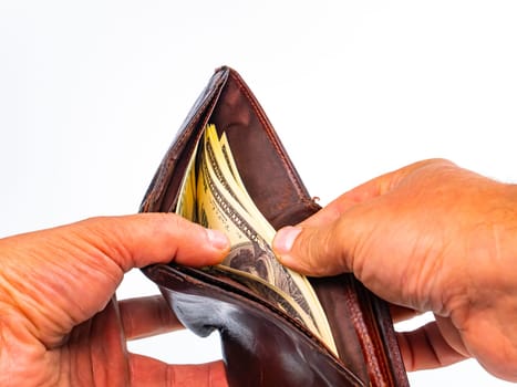 Hands count money American dollars in a man's wallet. Man's wallet with money. American dollar currency. Recalculation of salaries in the wallet. Business. Bank loan. Bank deposit. Finance.