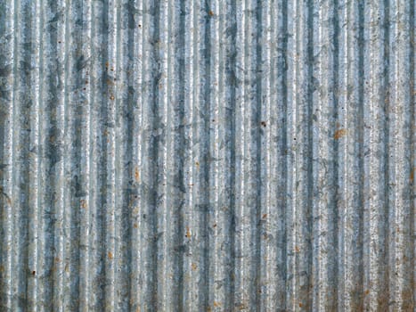 The texture of the ribbed stainless steel surface. Stainless steel. Ribbed metal surface. Corrugated iron sheet. Iron sheet. Figured metal. Background image. Free space for text. Texture.