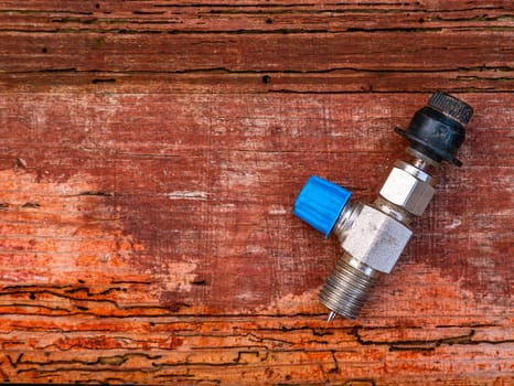 Freon cylinder needle valve for refrigerator repair. Needle valve for gas cylinder. Filling the refrigerator with freon. Filling the air conditioner with freon. Air conditioner repair. Work tool.