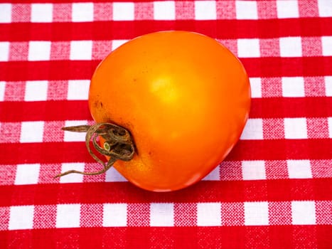 Yellow tomato vegetables on the kitchen table. Food photo. Harvesting tomato. Advertising photo of a shop window of a vegetable store. Agriculture. Farming activities. Place for text.