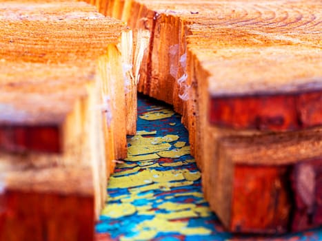 The texture of a transverse crack in a cut of pine wood. Chopped tree. Logging. Background image. Sawmill wood. Deforestation. Pine cut surface structure. Place for text. Texture.