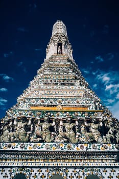 Wat Arun temple Colorful tiles floral pattern Mosaic on Pagoda Landmark Architecture .