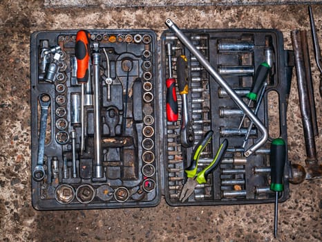A set of metal locksmith tools of a car repair mechanic. Iron wrench. Screwdriver and pliers. Tool kit. Car repair. Master equipment. Automotive workshop. Technician engineer. Working specialty.