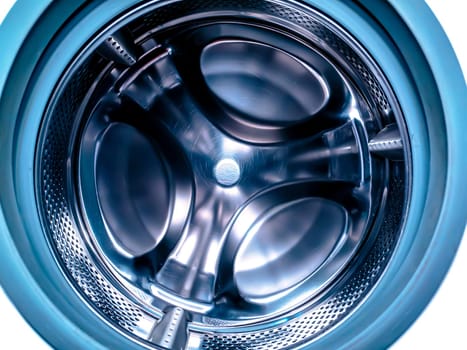 Metal drum of the washing machine made of stainless steel. Stainless steel tank. Washing machine repair service. Household appliances repair workshop. Mechanic repairman. Home wash.
