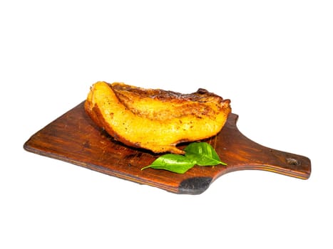 Baked lard with bay leaves on a cutting board. Pork meat. Baked lard. Pig fat. Pork. Bay leaf. Wooden cutting board. Grilling food. Cooking in the oven. Home kitchen. Recipe. White background.