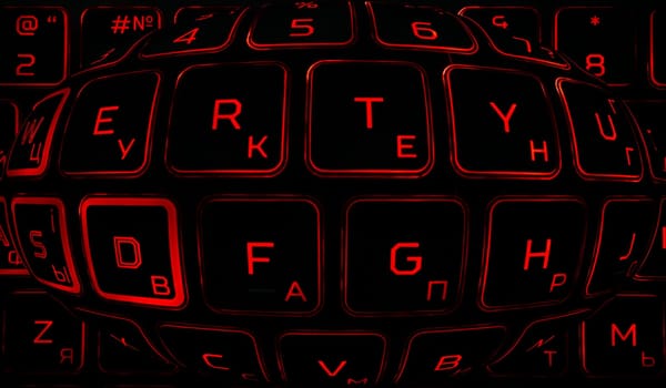 Computer keyboard in black and red colors abstract illustration. Computer techologies. Typing on the keyboard. Abstract background image. Red illumination of laptop buttons.