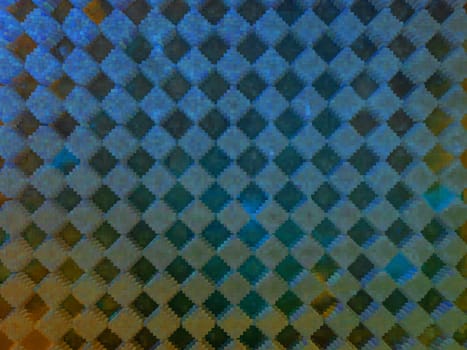 The texture of the plastic surface in black squares. Background image. Place for your text. Scratches on the plastic. The rhombus is black.