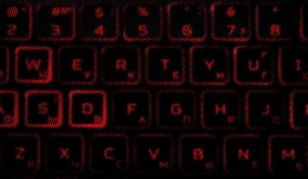 Computer keyboard in black and red colors abstract illustration. Computer techologies. Typing on the keyboard. Abstract background image. Red illumination of laptop buttons.