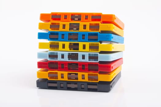 Collection of colorful audio tapes on white background