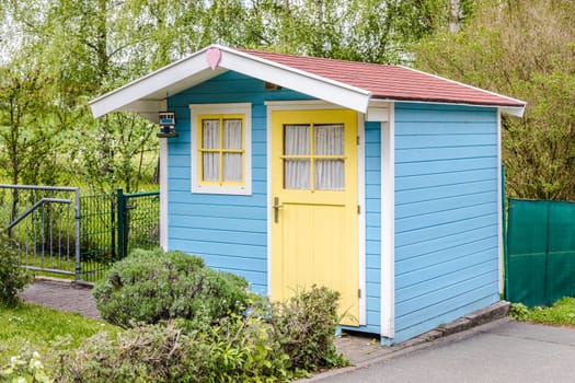Small Garden Shed or Tool Shed with yellow Door