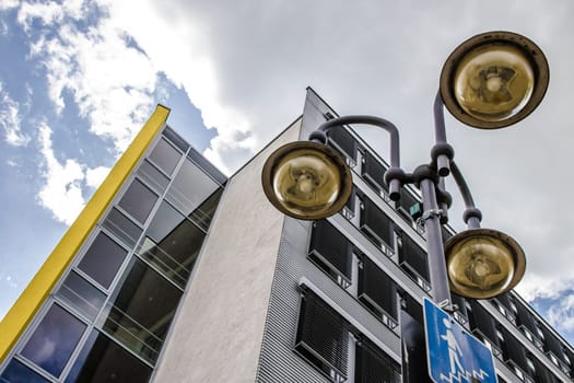 Picture from historic office building with street lightning on a sunny day in Germany