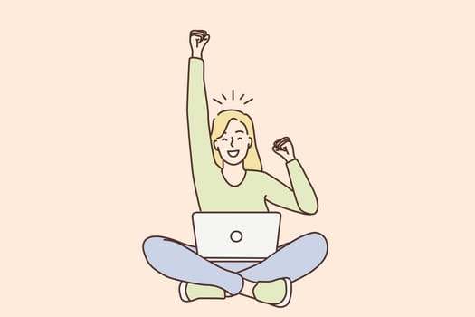 Celebrating success in work, freelance concept. Young smiling woman freelancer cartoon character sitting with laptop on knees with hand up gesturing like winner vector illustration