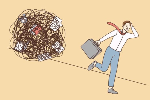 Stress, overload, burnout at work concept. Young stressed businessman worker cartoon character running away from messy chaotic circle of duties vector illustration