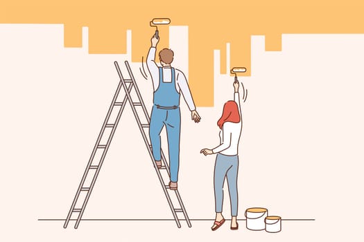 Home renovation and repairing concept. Young couple man and woman standing backwards painting wall in new apartment in yellow vector illustration