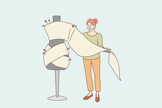 Dressmaking and fashion design concept. Young smiling woman cartoon character standing holding textile for making sewing dress or costume vector illustration