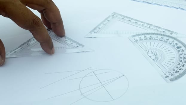 Design Professional using drawing tools close up