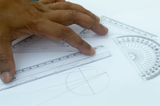 Design Professional using drawing tools close up