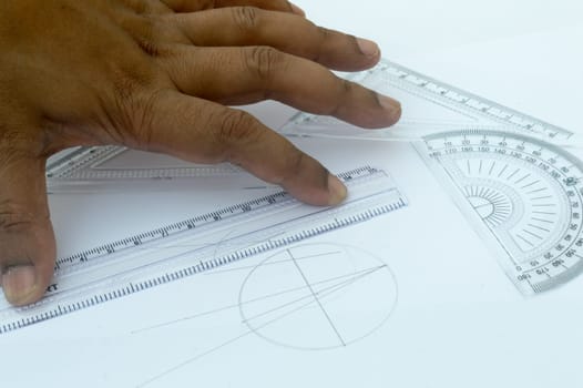 Design Professional using drawing tools close up