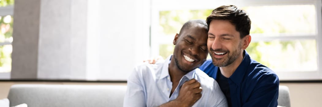 Romantic Happy Gay Couple Relaxing On Couch