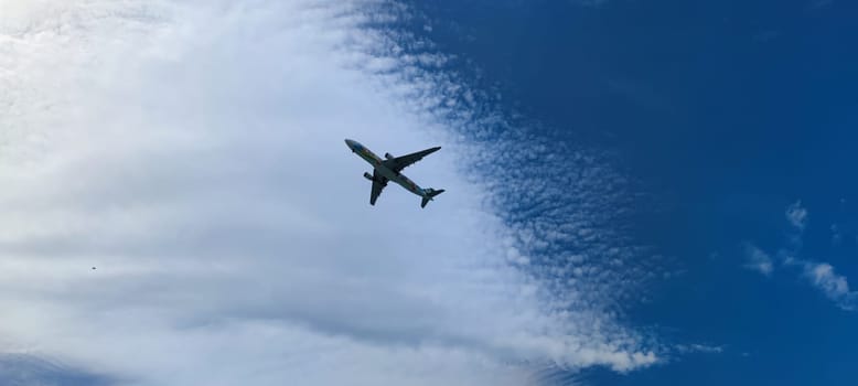 The Airplane in the sky at sunrise or sunset