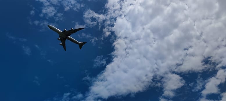 The Airplane in the sky at sunrise or sunset