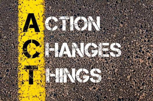 Action Changes Things - ACT Concept.  Conceptual image with yellow paint line on the road over asphalt stone background.