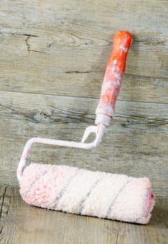 paint roller on a wooden table