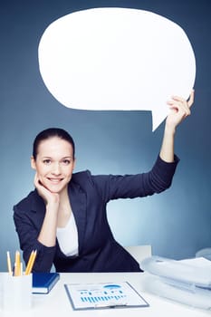 Smiling businesswoman showing blank speech bubble