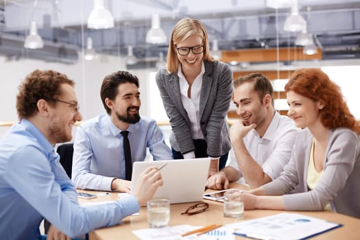 Group of business partners discussing ideas or strategies at meeting