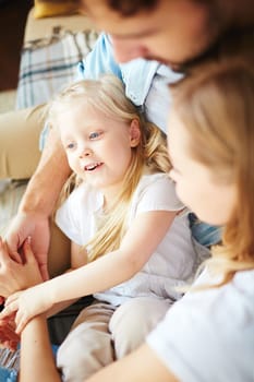 Cute little girl resting with her parents