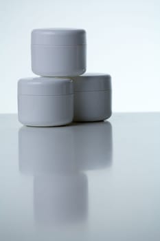 Three cream cans stacked - blue-grey