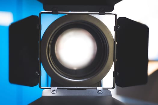 Professional studio spotlight in a TV studio. Lighting equipment for photography or videography.